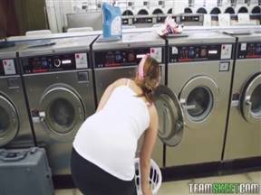 Young girl whores with a man in a laundromat